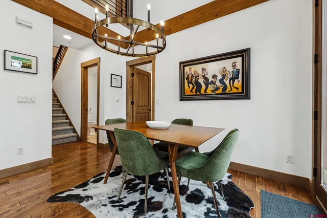 a living room with furniture pool table and a fireplace