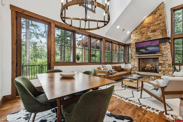 a bathroom with a granite countertop toilet sink and mirror