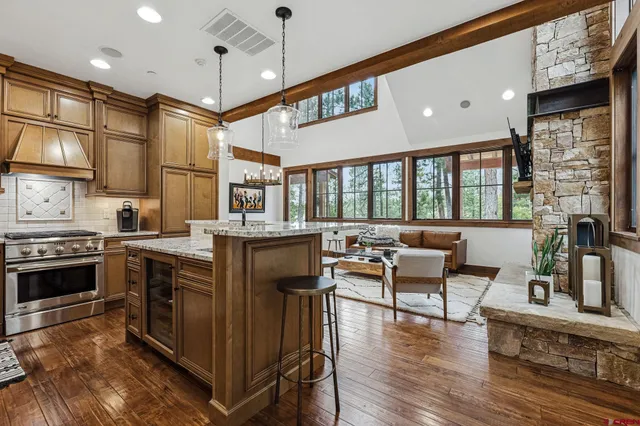 a kitchen with stainless steel appliances granite countertop a stove and a refrigerator