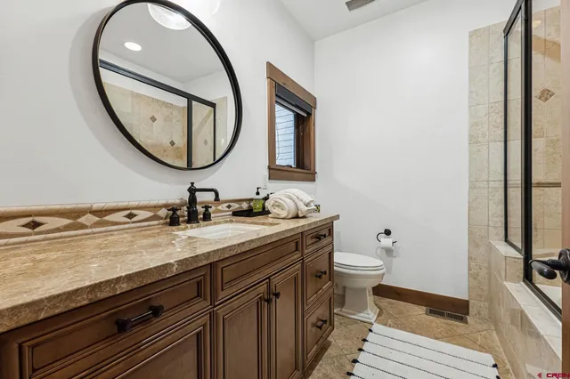 a front view of house with a garden