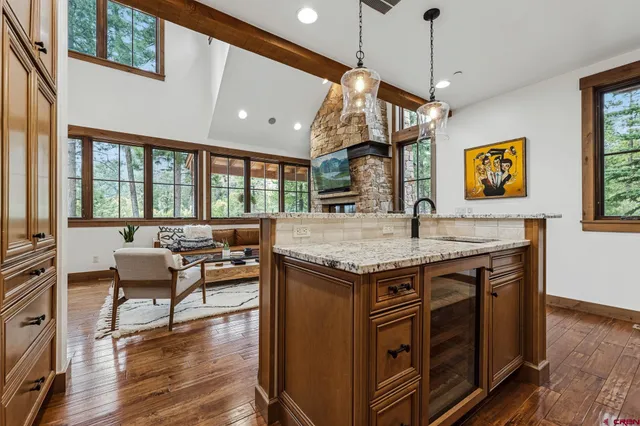 a view of a kitchen counter space and wooden floor