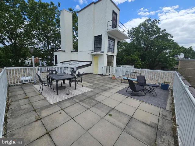 a view of backyard with sitting area