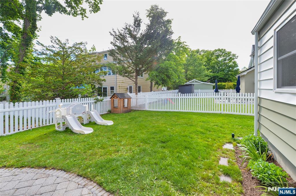 570 Shelton Road Ridgewood, NJ 07450 - Photo 24 of 26 a view of a house with backyard and a hammock