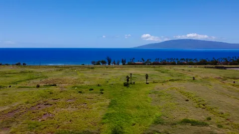 a view of an ocean beach and a building
