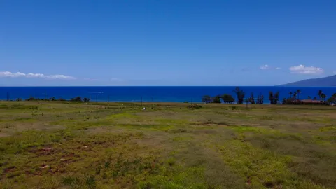 a view of an ocean and a mountain