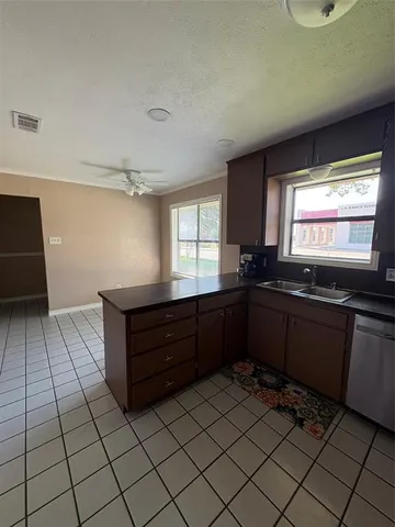 a kitchen with a sink and cabinets