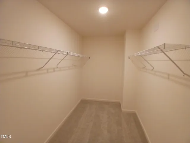 a view of a room with racks on the wall