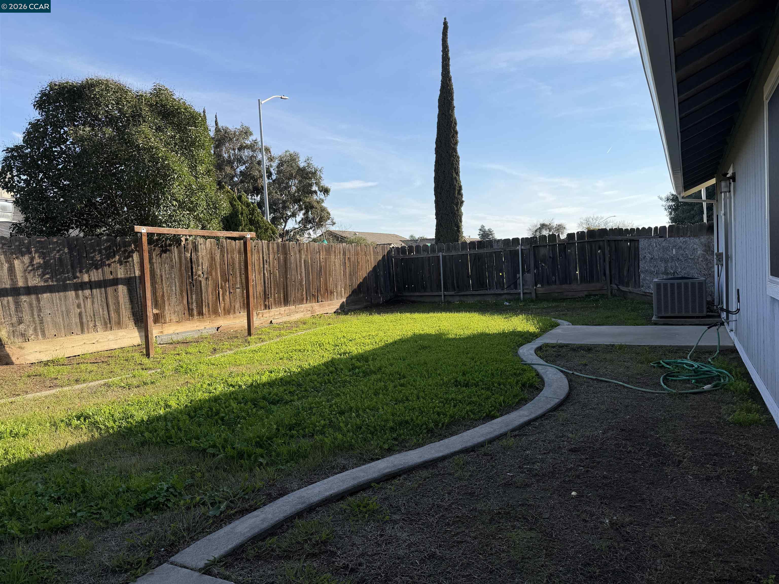 2510 Peppertree Drive Merced, CA 95348 - Photo 14 of 15 a view of a backyard with a slide