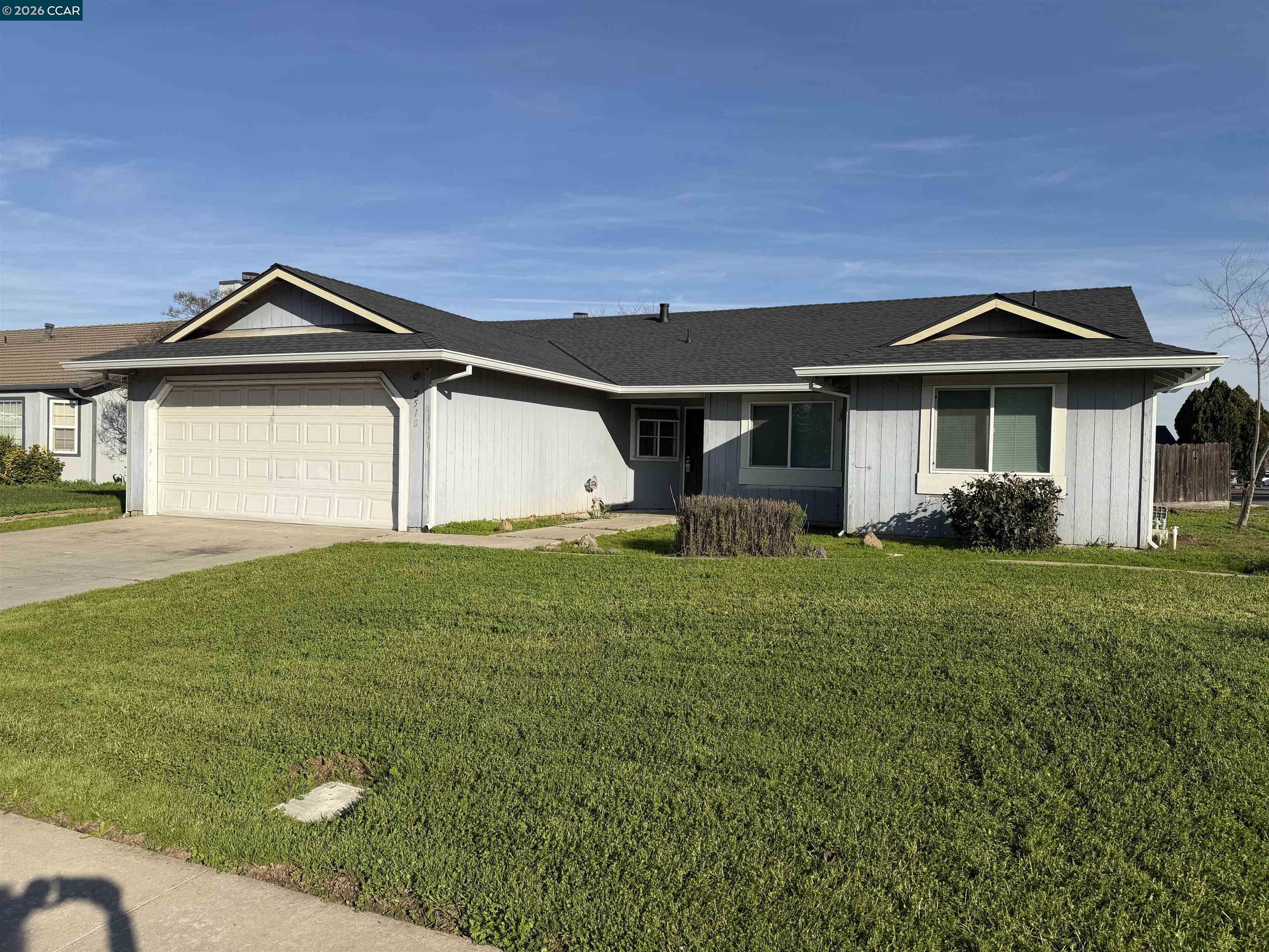 2510 Peppertree Drive Merced, CA 95348 - Photo 2 of 15 a front view of a house with garden