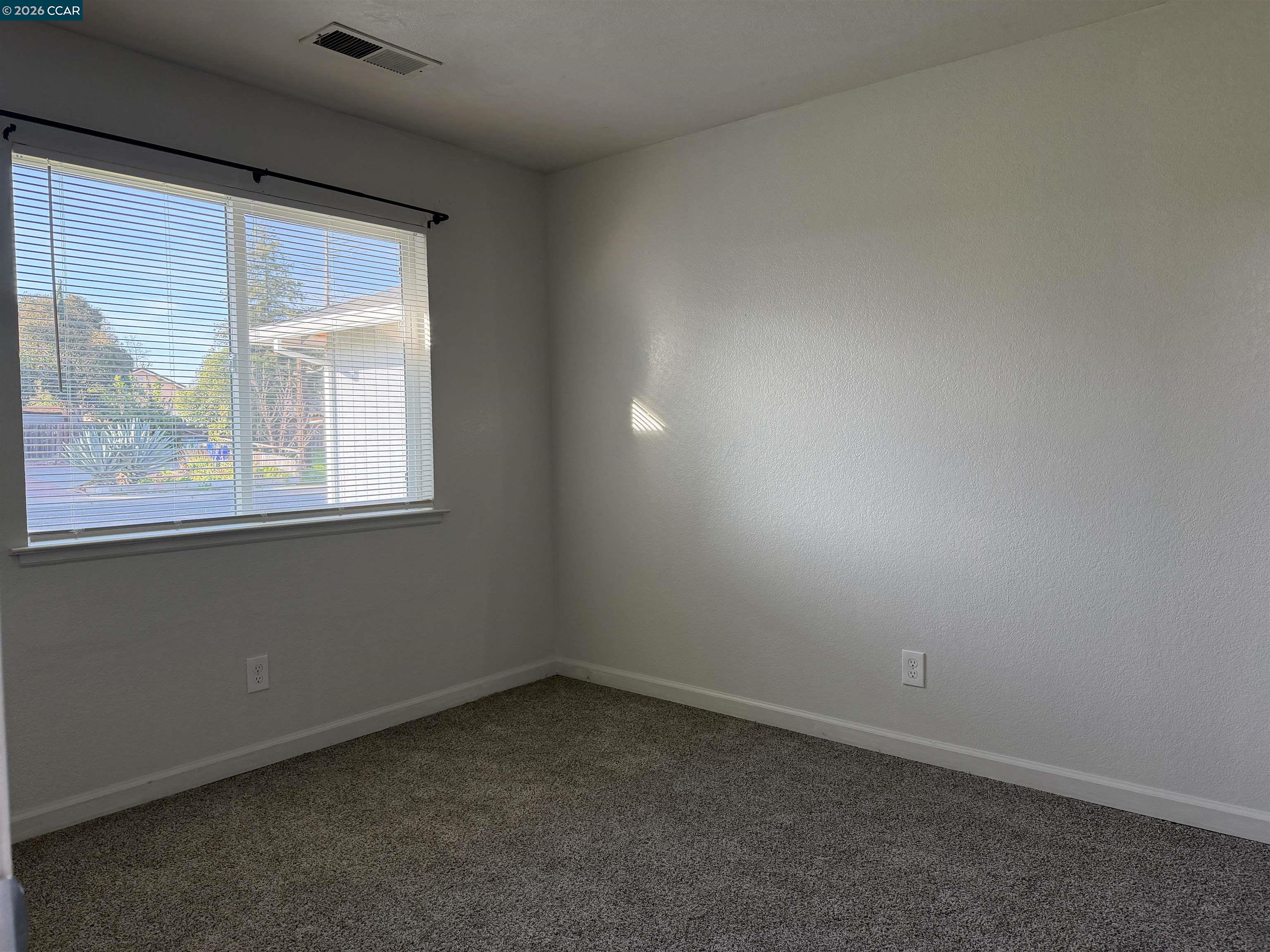 2510 Peppertree Drive Merced, CA 95348 - Photo 8 of 15 an empty room with a window