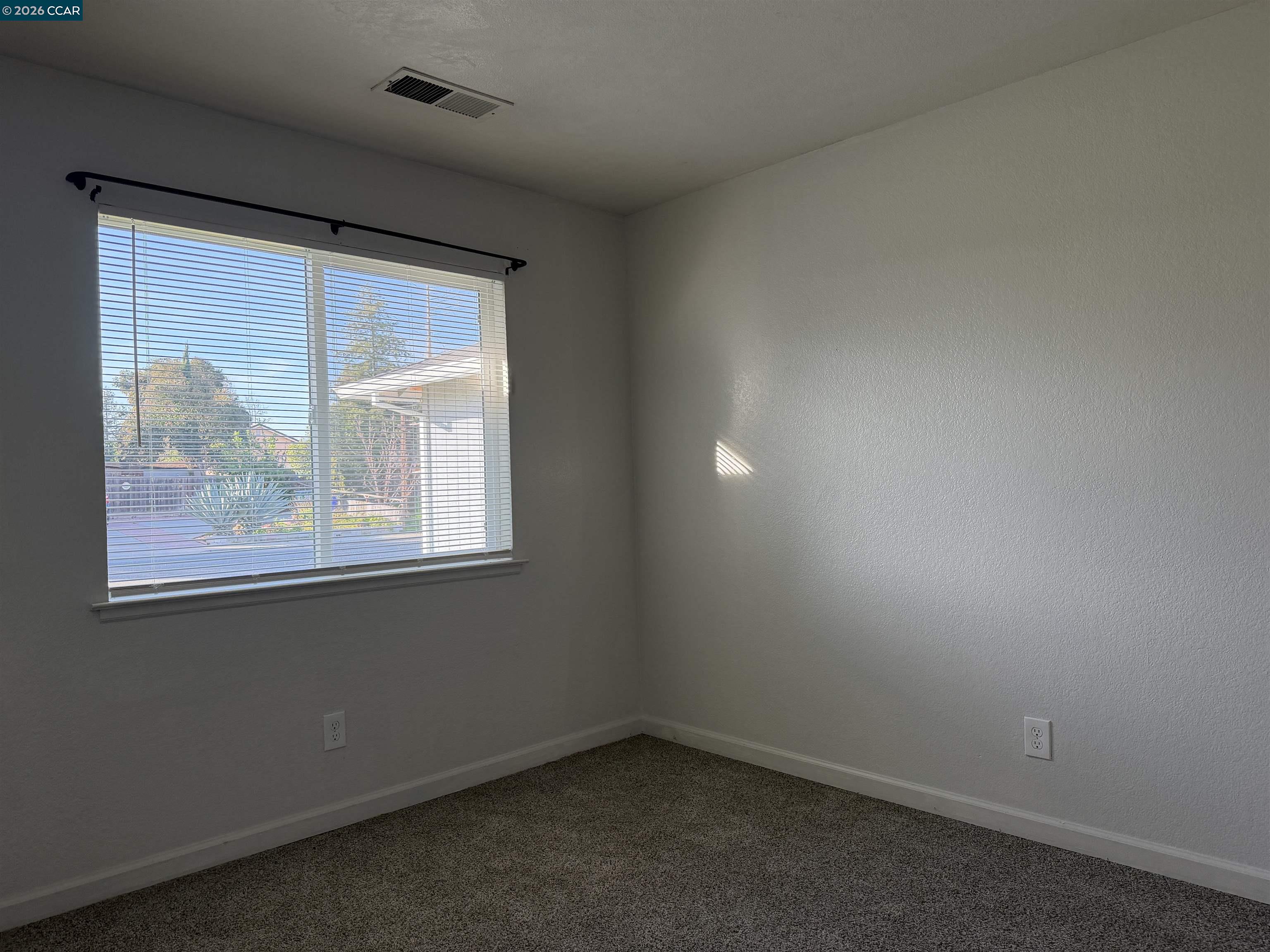 2510 Peppertree Drive Merced, CA 95348 - Photo 10 of 15 an empty room with a window