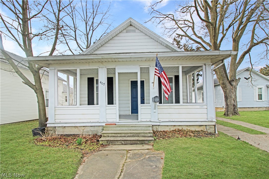 407 Fremont Road Port Clinton, OH 43452 - Photo 22 of 22 Bungalow-style home with a front lawn and a porch