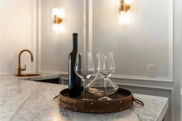 a kitchen with stainless steel appliances kitchen island granite countertop a table and chairs in it