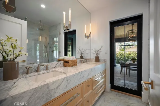 a spacious bedroom with a large bed and a dresser