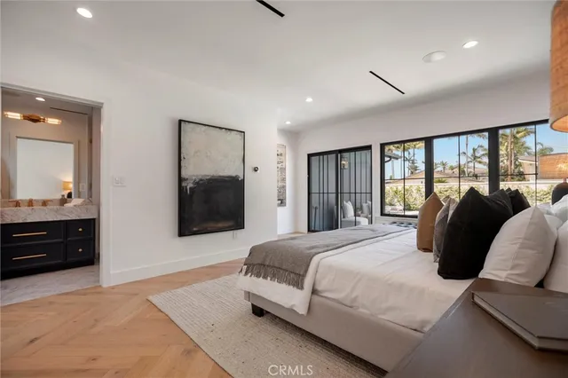 a bedroom with a bed and a couch