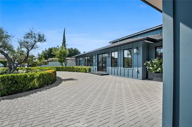 a view of a dining room with furniture and a potted plant