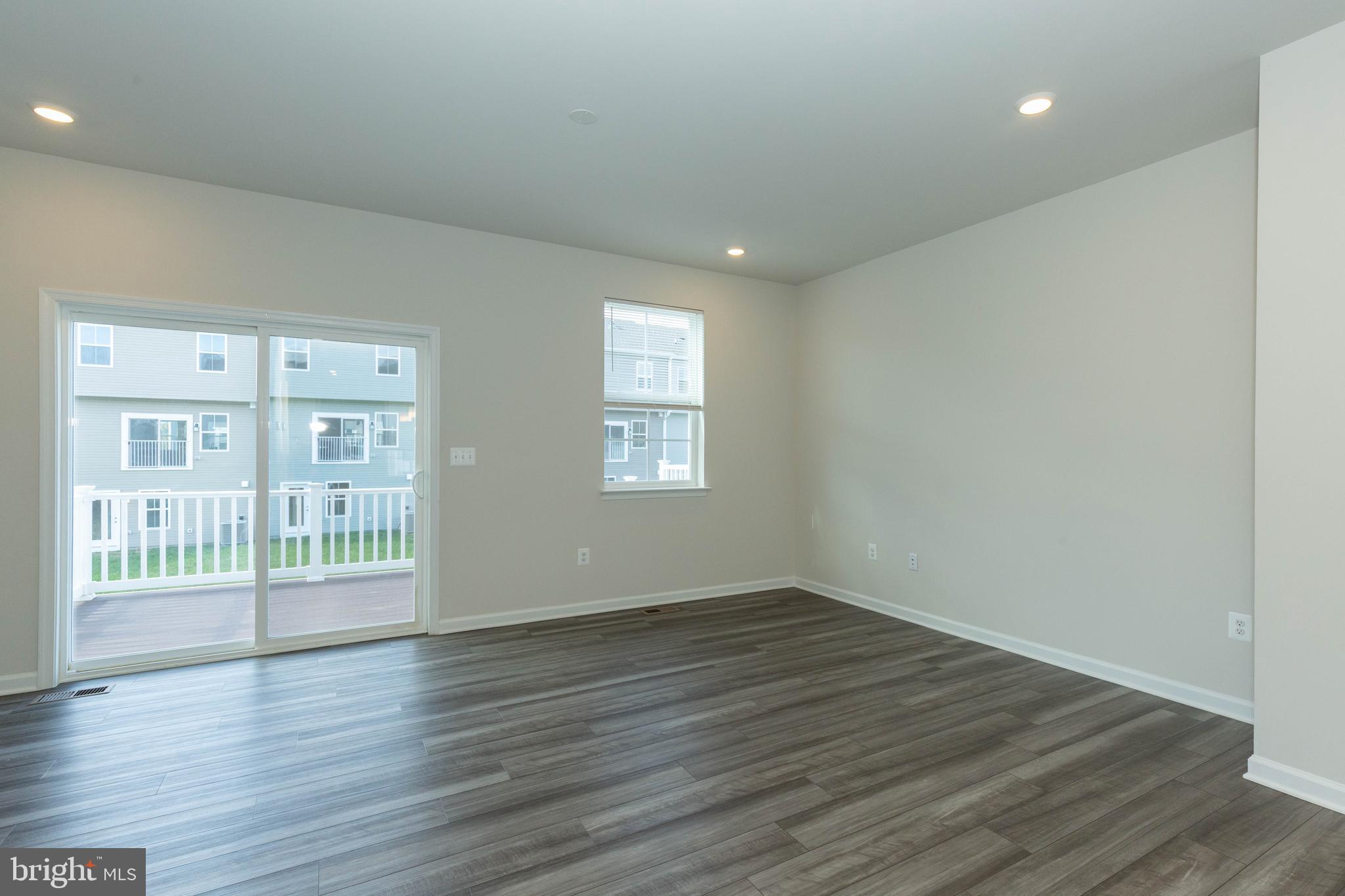 158 Cooperage Road Inwood, WV 25428 - Photo 11 of 25 a view of an empty room with wooden floor and a window