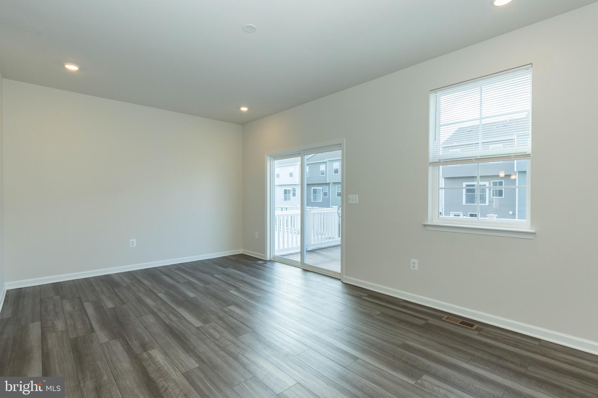 158 Cooperage Road Inwood, WV 25428 - Photo 12 of 25 a view of an empty room with wooden floor and a window