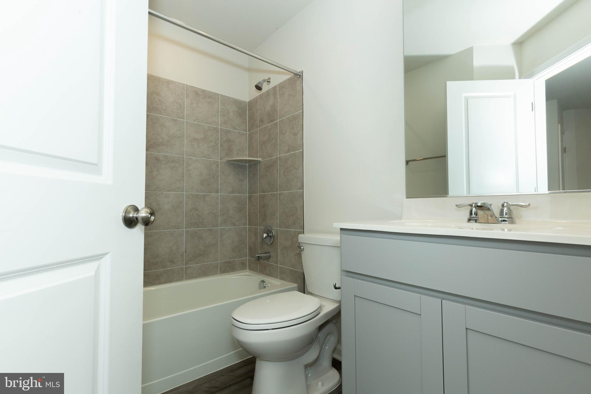 158 Cooperage Road Inwood, WV 25428 - Photo 21 of 25 a bathroom with a sink toilet and shower