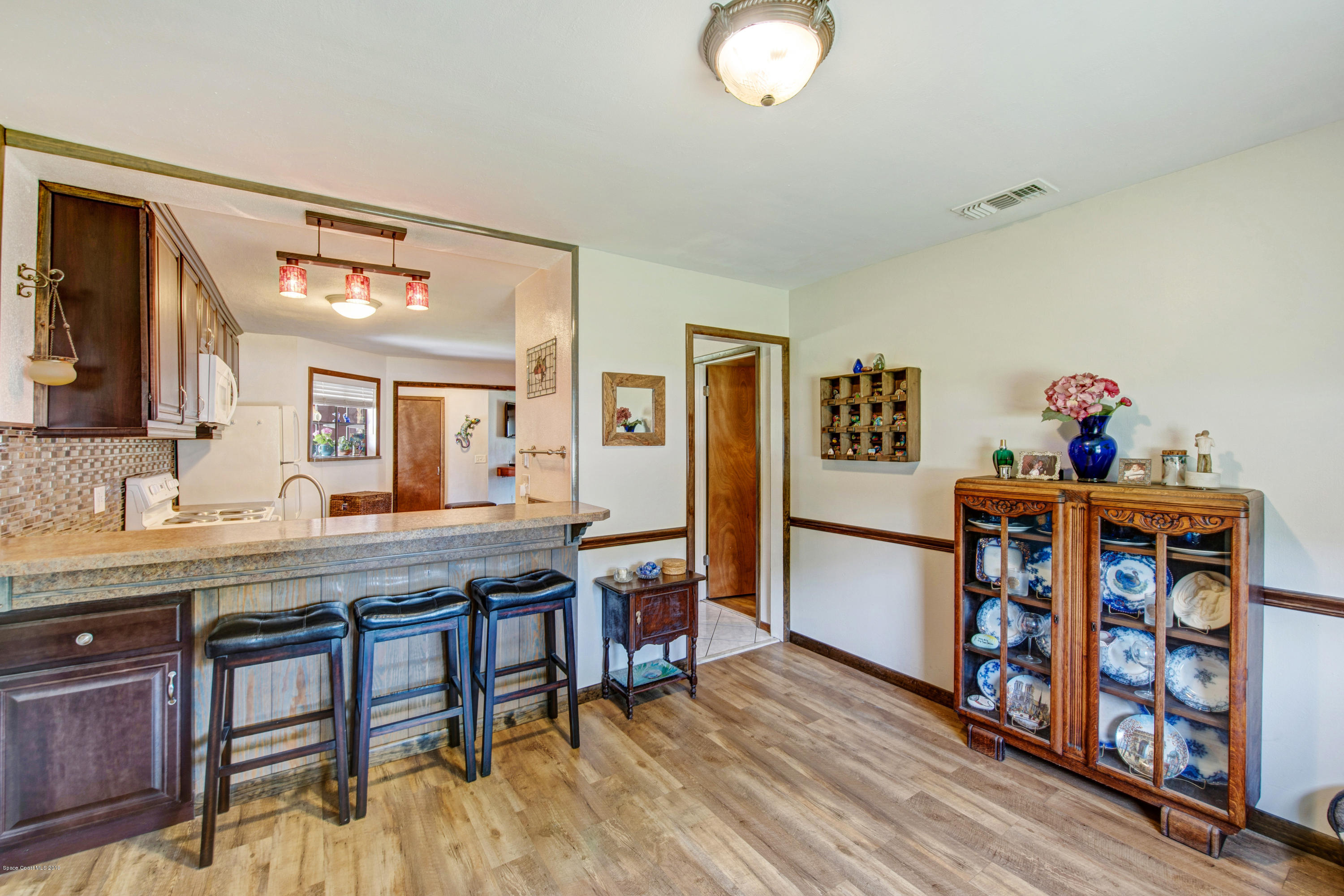 993 Cherokee Road Southeast Palm Bay, FL 32909 - Photo 13 of 35 Dining Room To Kitchen