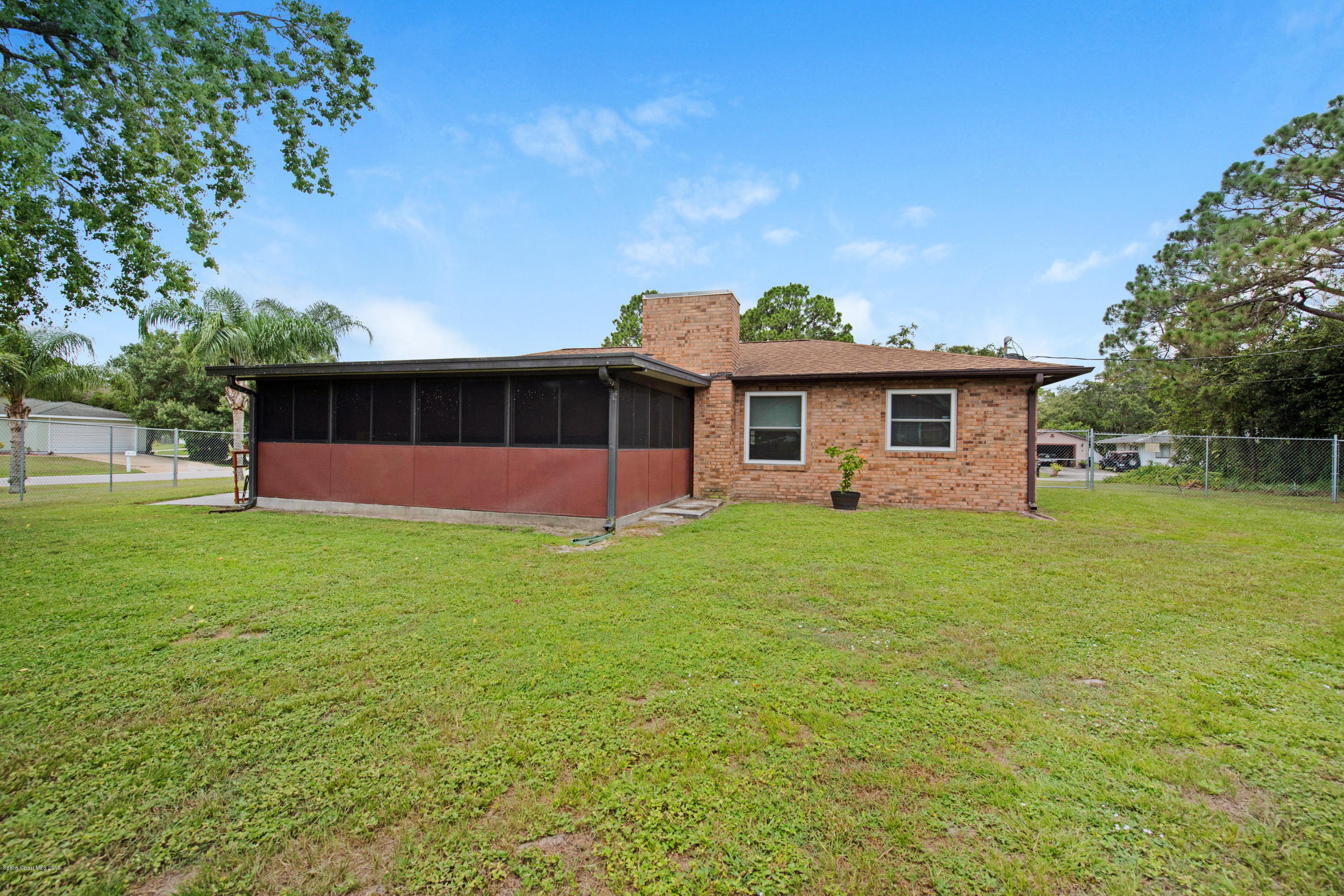 993 Cherokee Road Southeast Palm Bay, FL 32909 - Photo 24 of 35 Fully Fenced Yard