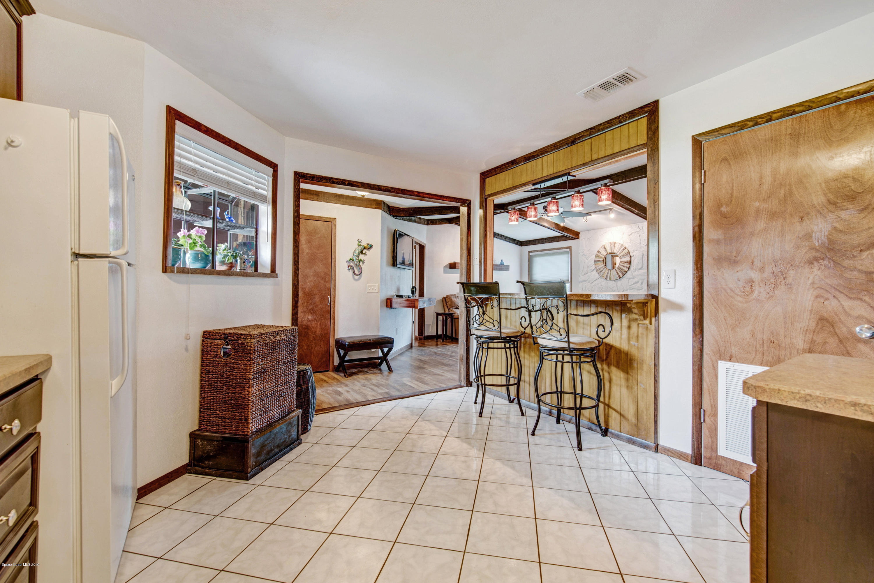 993 Cherokee Road Southeast Palm Bay, FL 32909 - Photo 7 of 35 Bar Off Kitchen