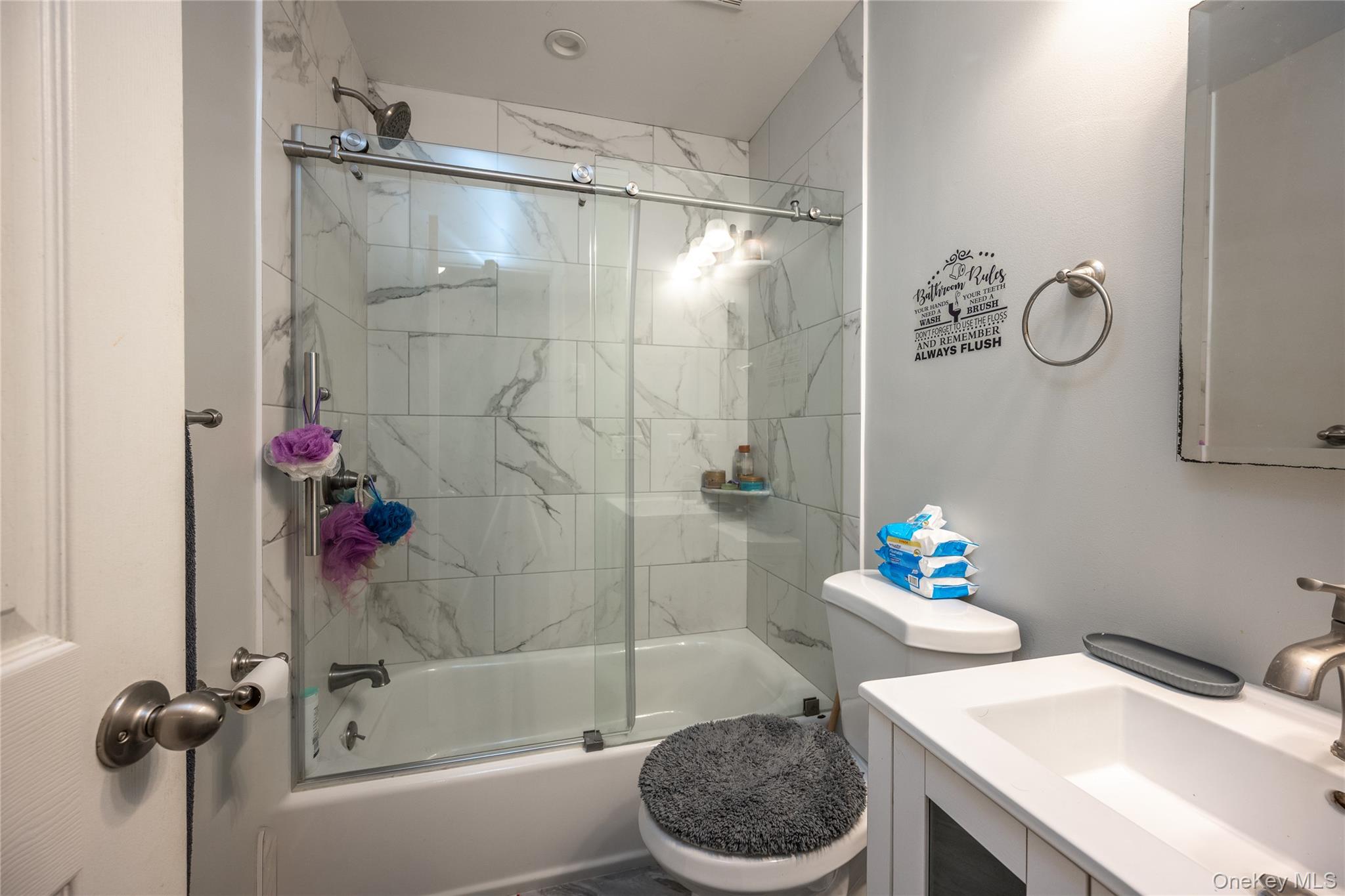 76 Derick Drive Fishkill, NY 12524 - Photo 19 of 27 a bathroom with a sink a toilet and shower