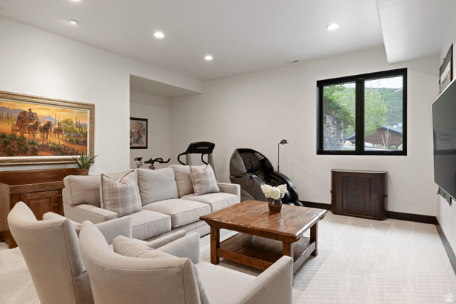 11547 Soaring Hawk Lane Hideout, UT 84036 - Photo 32 of 43 Spacious lower-level room featuring light-toned carpeting and recessed lighting