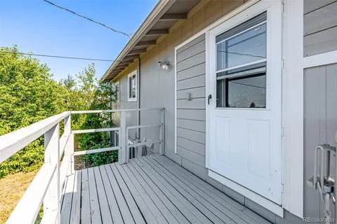 a large tree in front of a house