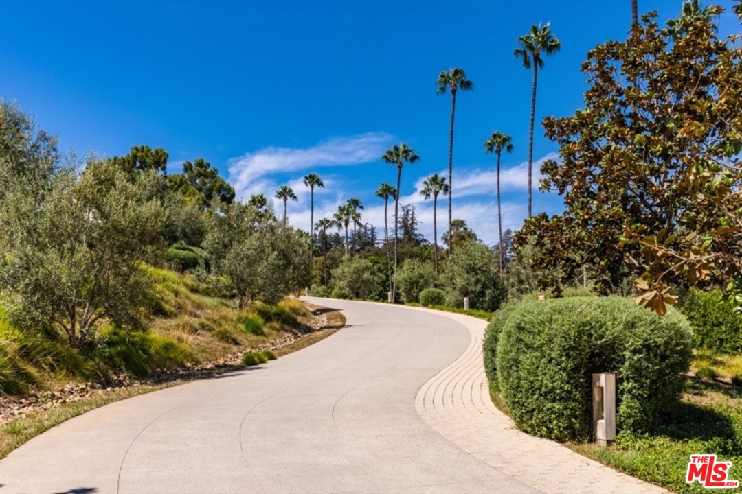 911 Foothill Road Beverly Hills, CA 90210 - Photo 2 of 21 a view of a house with a street