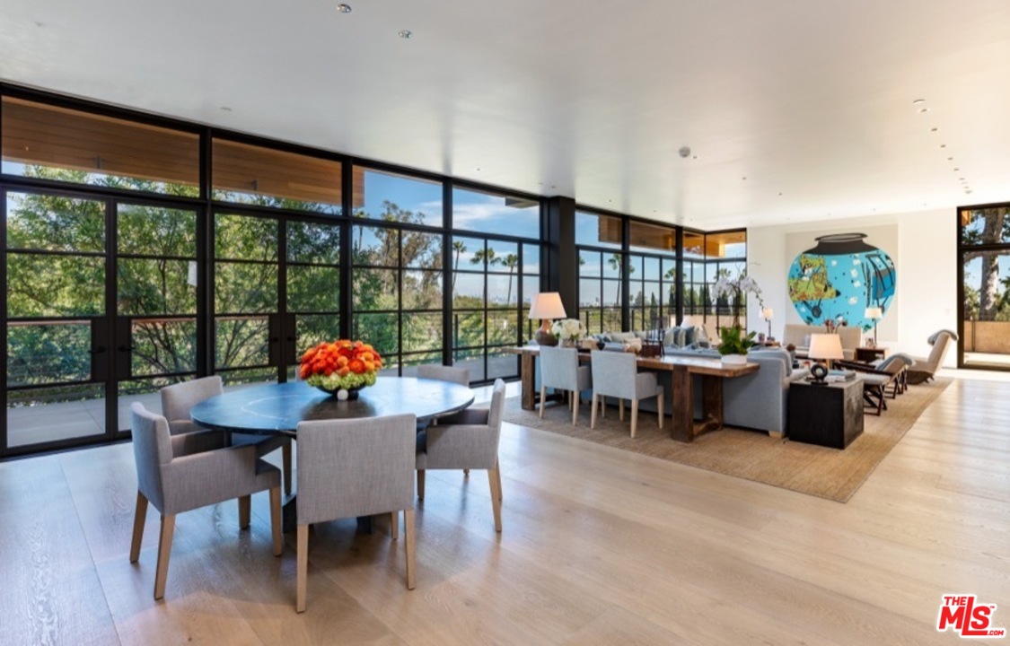 911 Foothill Road Beverly Hills, CA 90210 - Photo 11 of 21 a view of a dining room with furniture and a potted plant