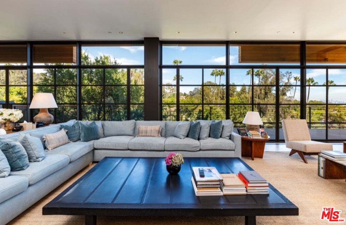 911 Foothill Road Beverly Hills, CA 90210 - Photo 12 of 21 a living room with furniture and a large window