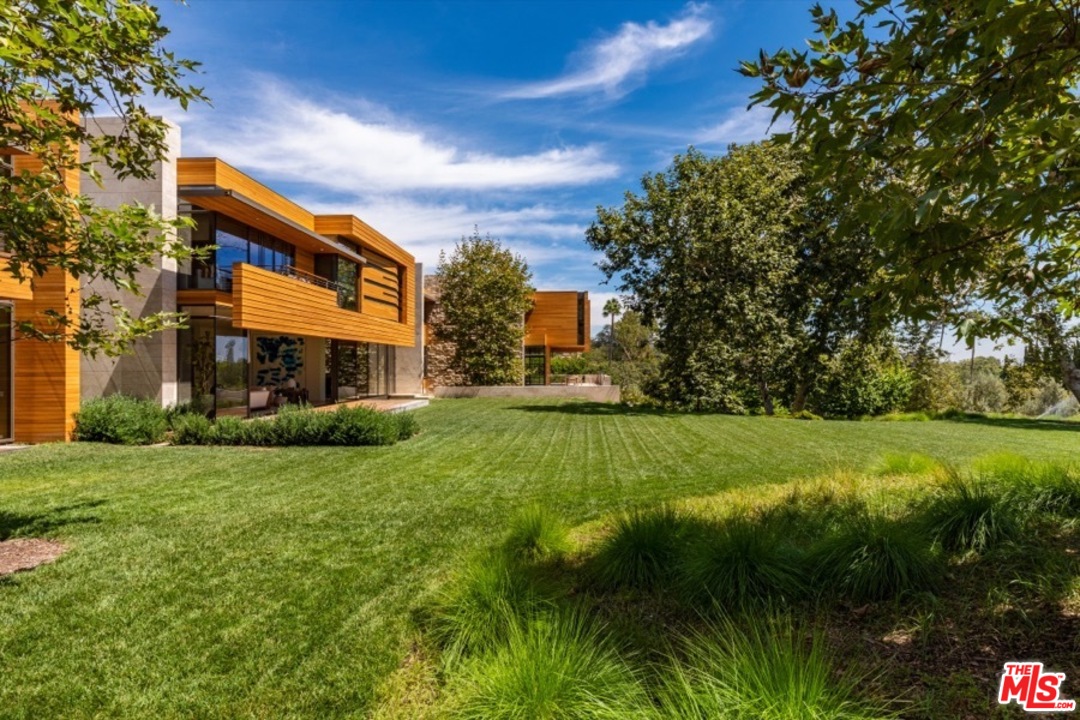 911 Foothill Road Beverly Hills, CA 90210 - Photo 19 of 21 a view of a house with a yard