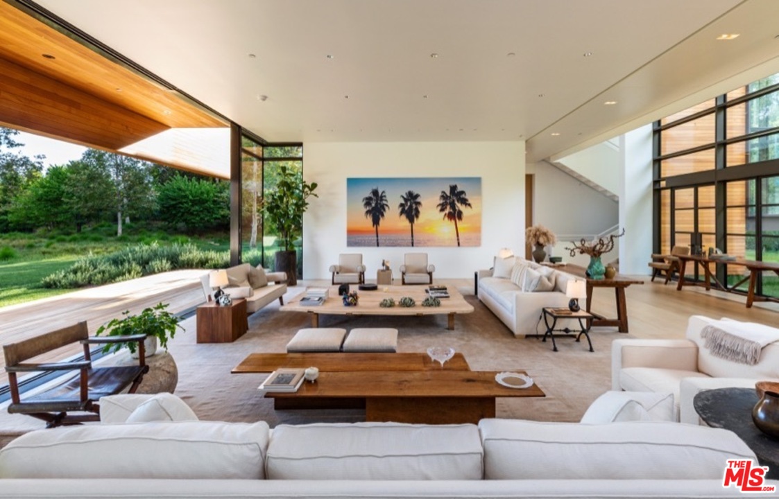 911 Foothill Road Beverly Hills, CA 90210 - Photo 6 of 21 a living room with patio furniture and a garden