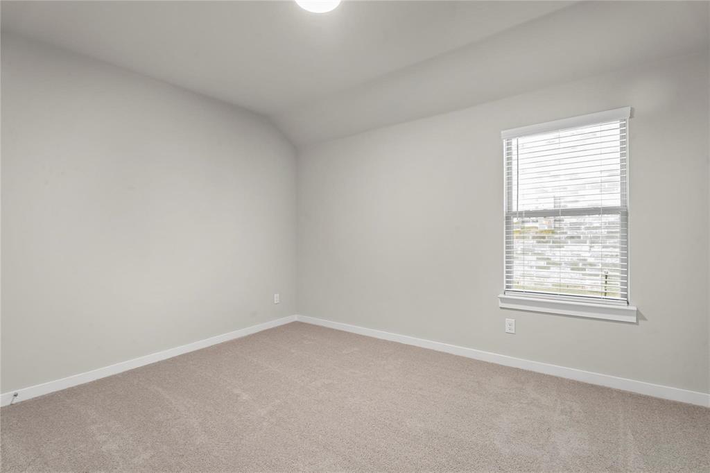 507 Avocet Road Princeton, TX 75407 - Photo 16 of 31 Neutral-toned carpeting, white walls, and a single window with blinds