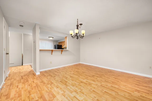 a view of a hallway with a chandelier