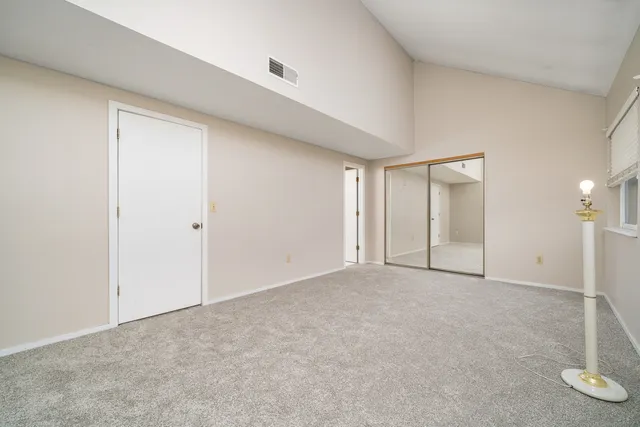 an empty room with closet area