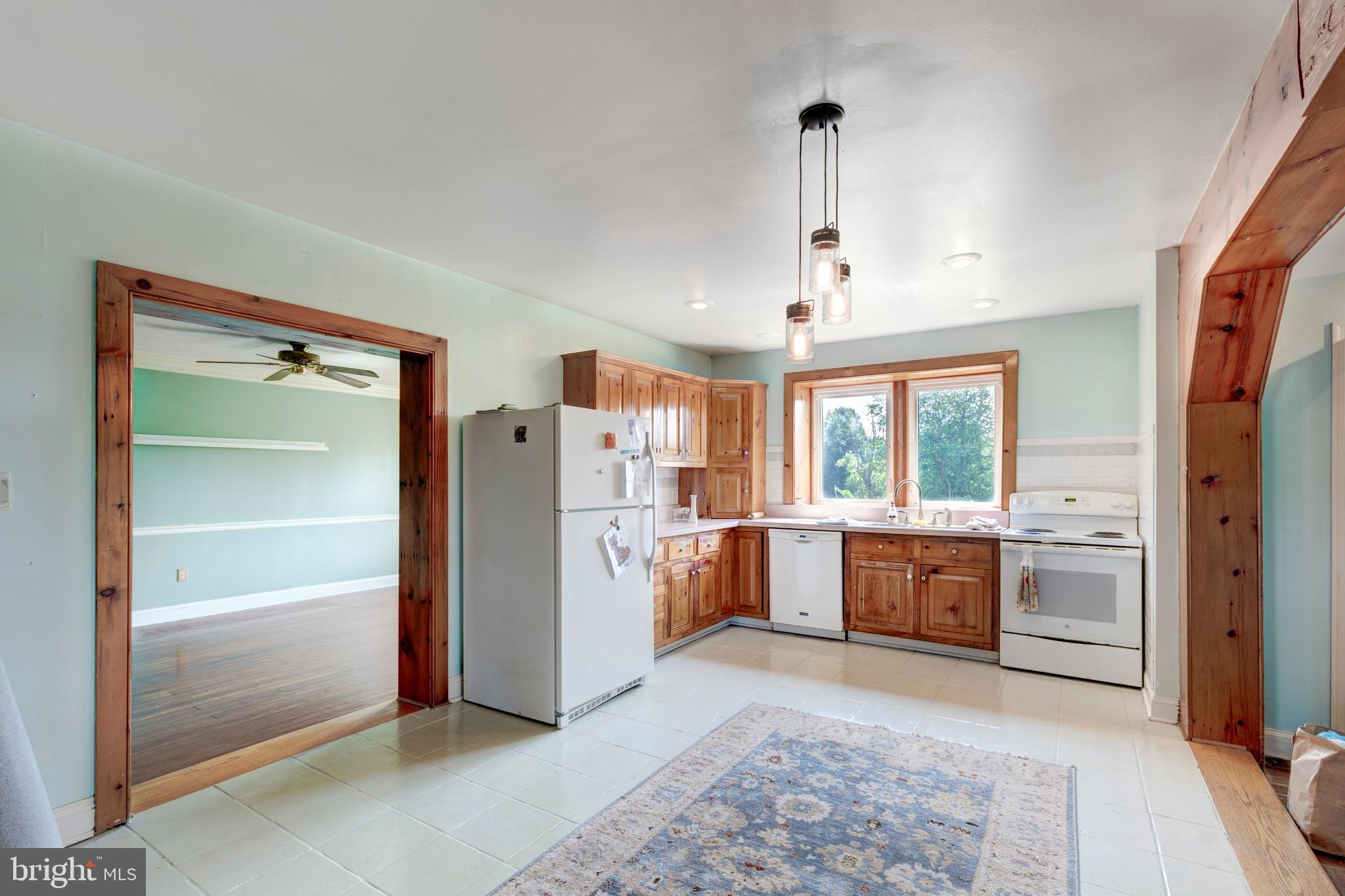 1845 Benson Road Westminster, MD 21158 - Photo 25 of 62 a view of a kitchen with refrigerator and window