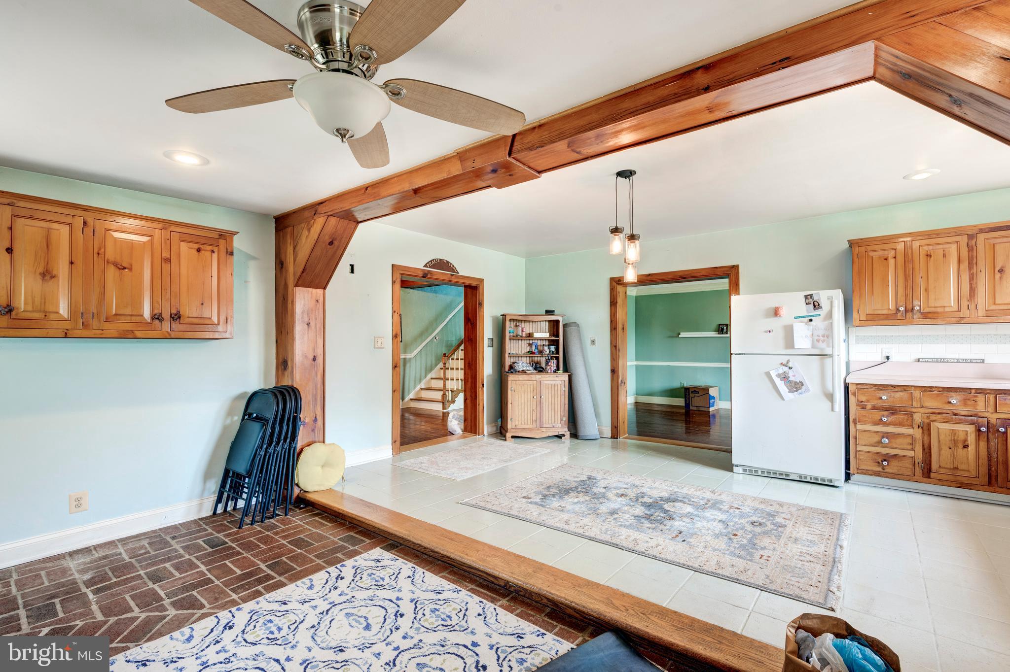 1845 Benson Road Westminster, MD 21158 - Photo 29 of 62 a living room with stainless steel appliances kitchen island granite countertop furniture and a rug