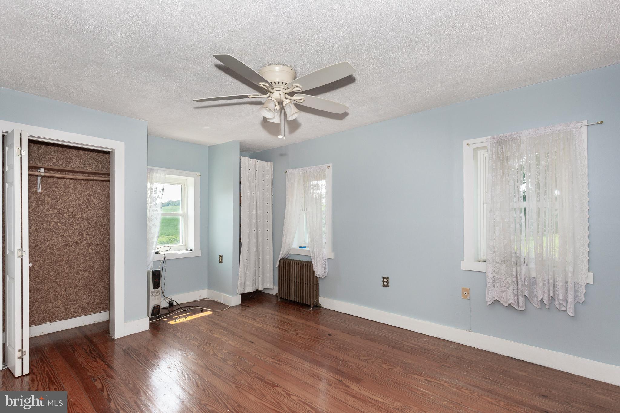 1845 Benson Road Westminster, MD 21158 - Photo 33 of 62 a view of an empty room with wooden floor and a window