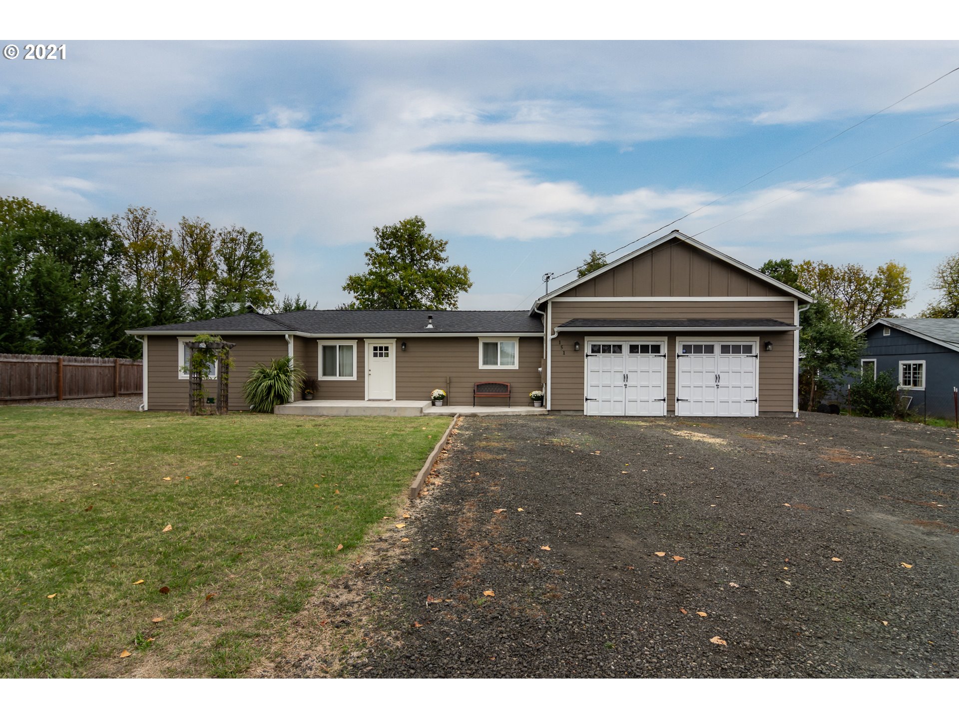 151 North Side Road Sutherlin, OR 97479 - Photo 1 of 27 a view of a house with a yard and large tree