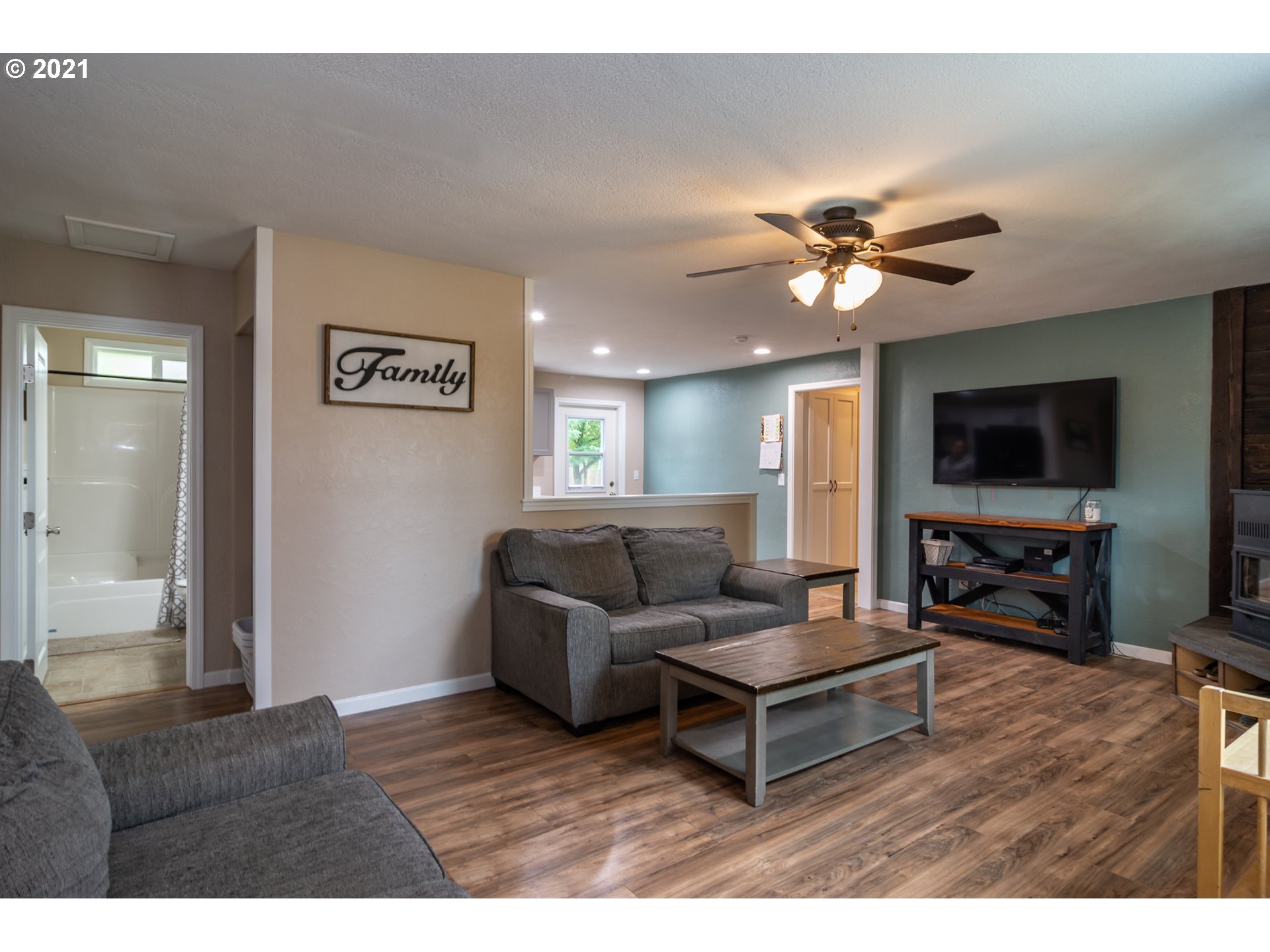 151 North Side Road Sutherlin, OR 97479 - Photo 2 of 27 a living room with furniture and a flat screen tv
