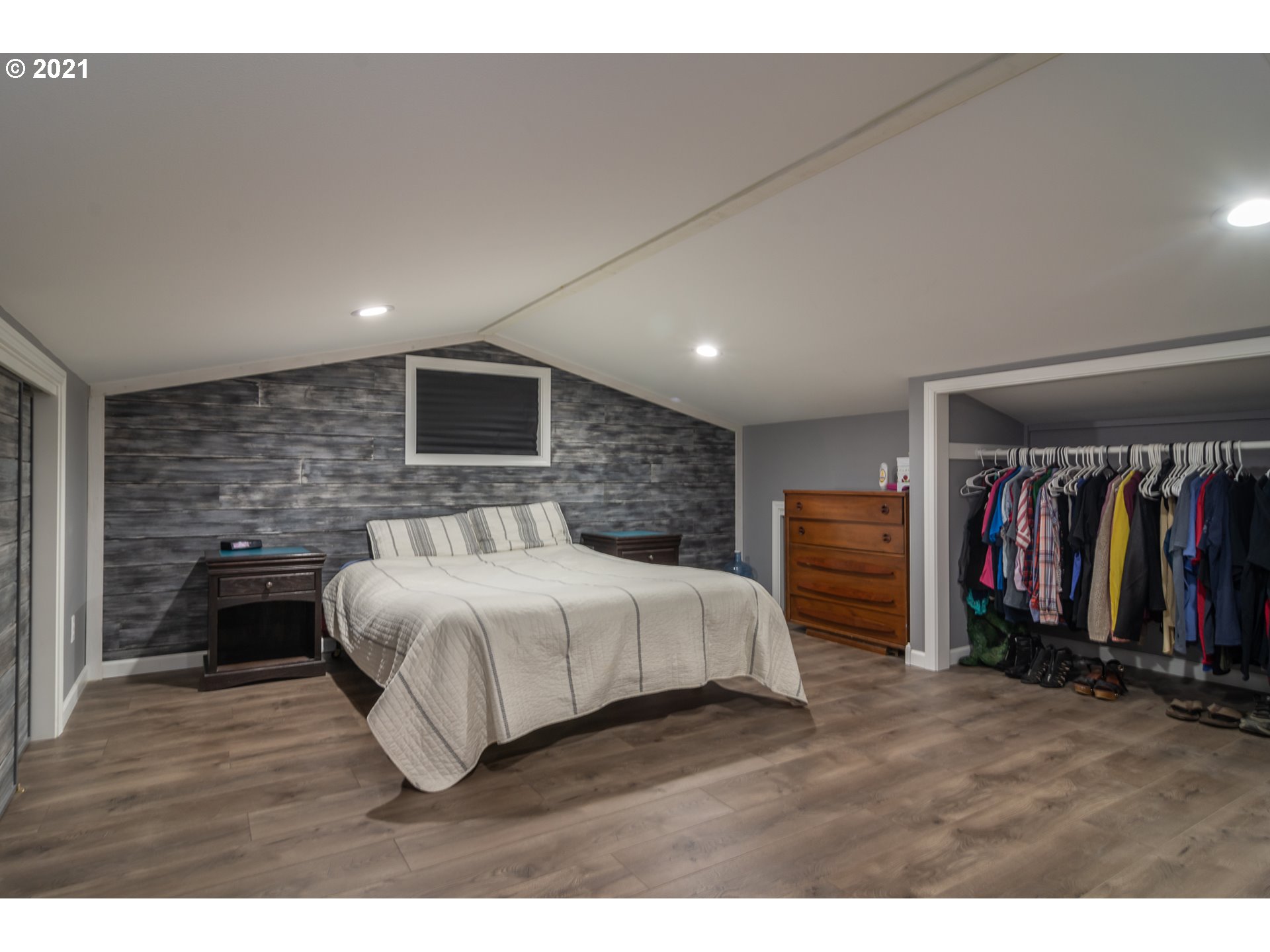 151 North Side Road Sutherlin, OR 97479 - Photo 14 of 27 a spacious bedroom with a bed and a walk in closet