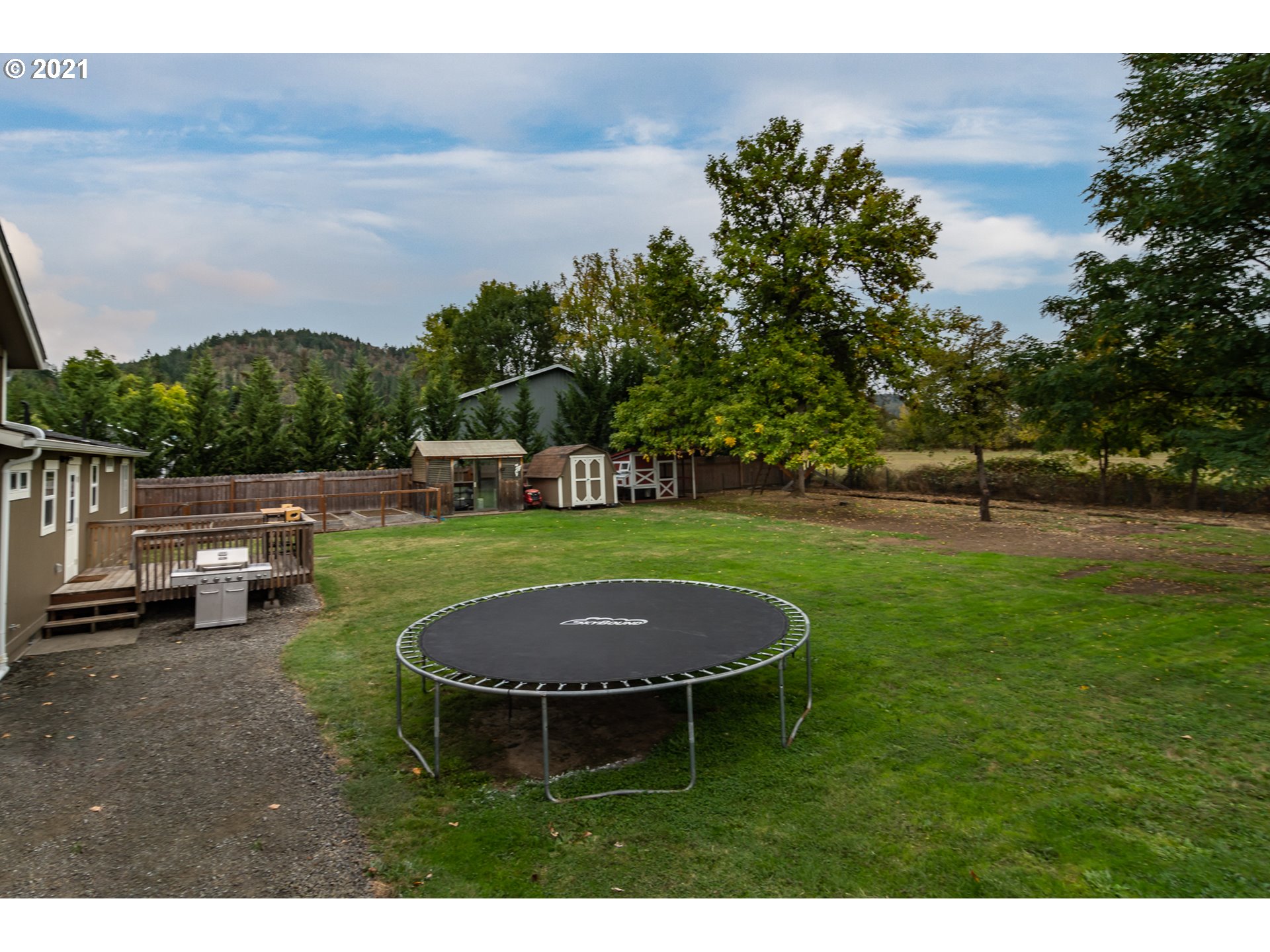 151 North Side Road Sutherlin, OR 97479 - Photo 19 of 27 a swimming pool with some trees in the background