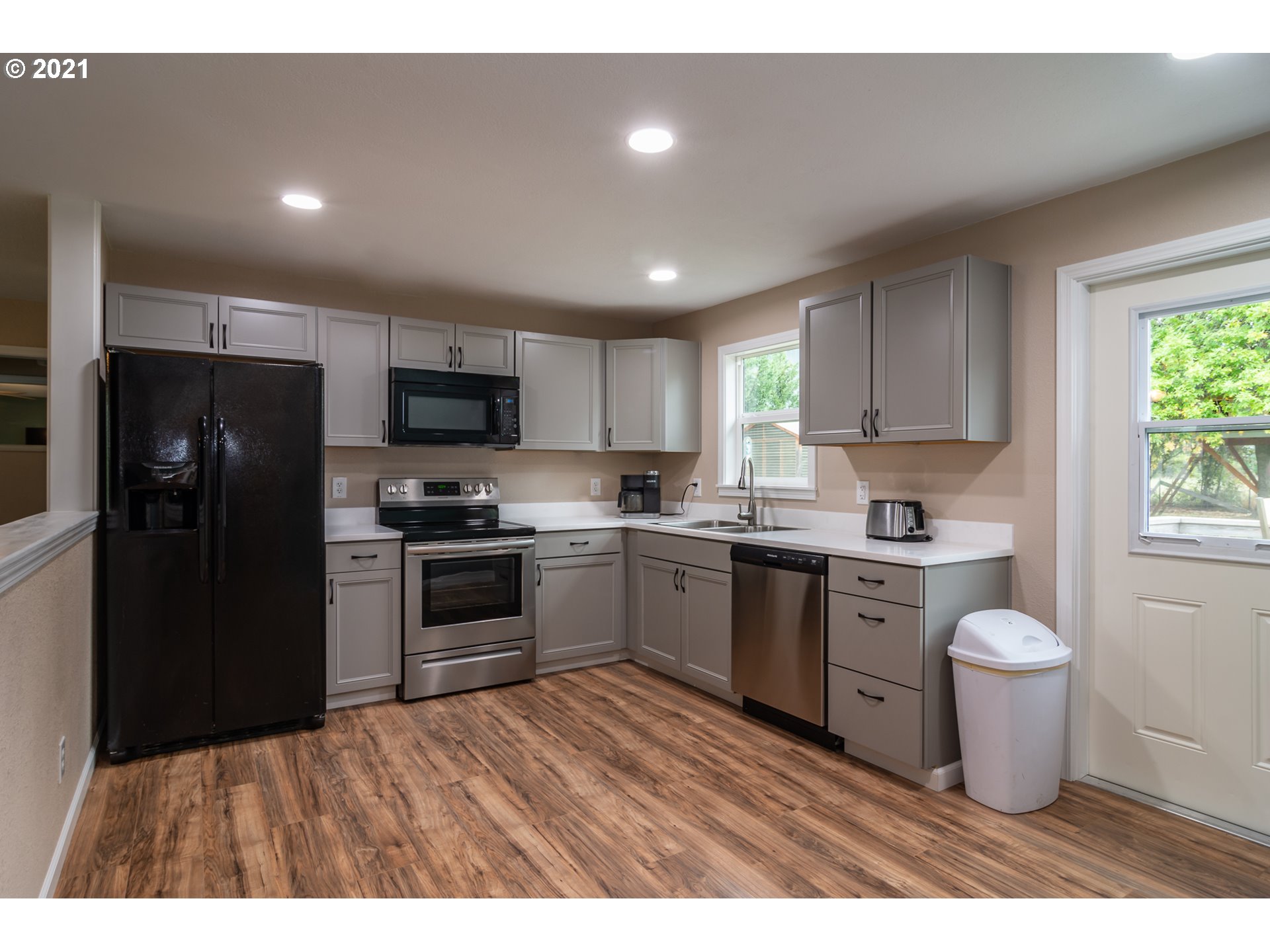 151 North Side Road Sutherlin, OR 97479 - Photo 5 of 27 a kitchen with a refrigerator sink and stove