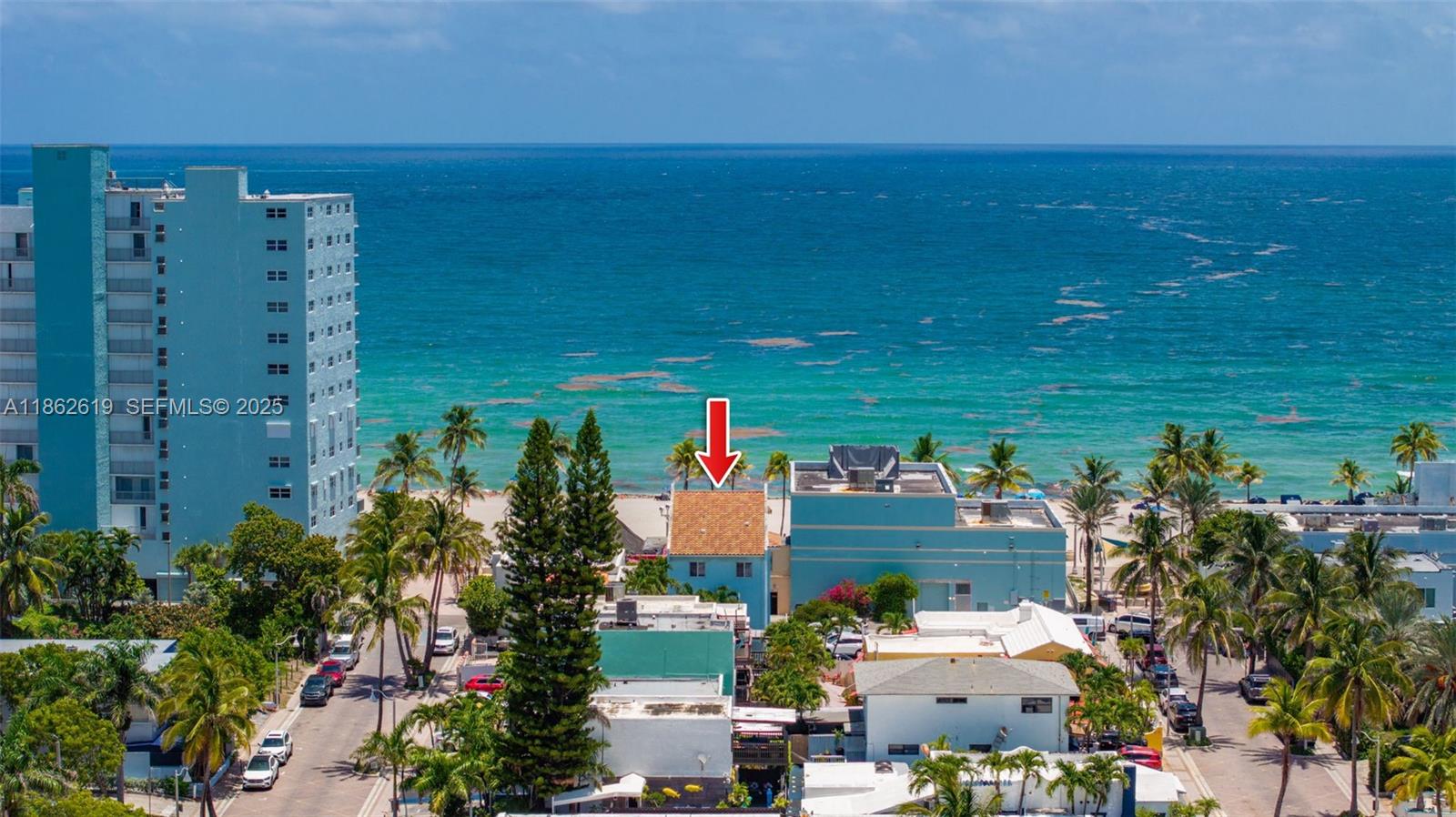 311 North Surf Road, Unit 311 Hollywood, FL 33019 - Photo 2 of 68 an aerial view of a house with a yard and lake view