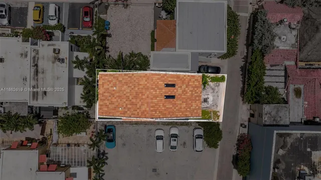 a kitchen with granite countertop a sink white cabinets and white appliances