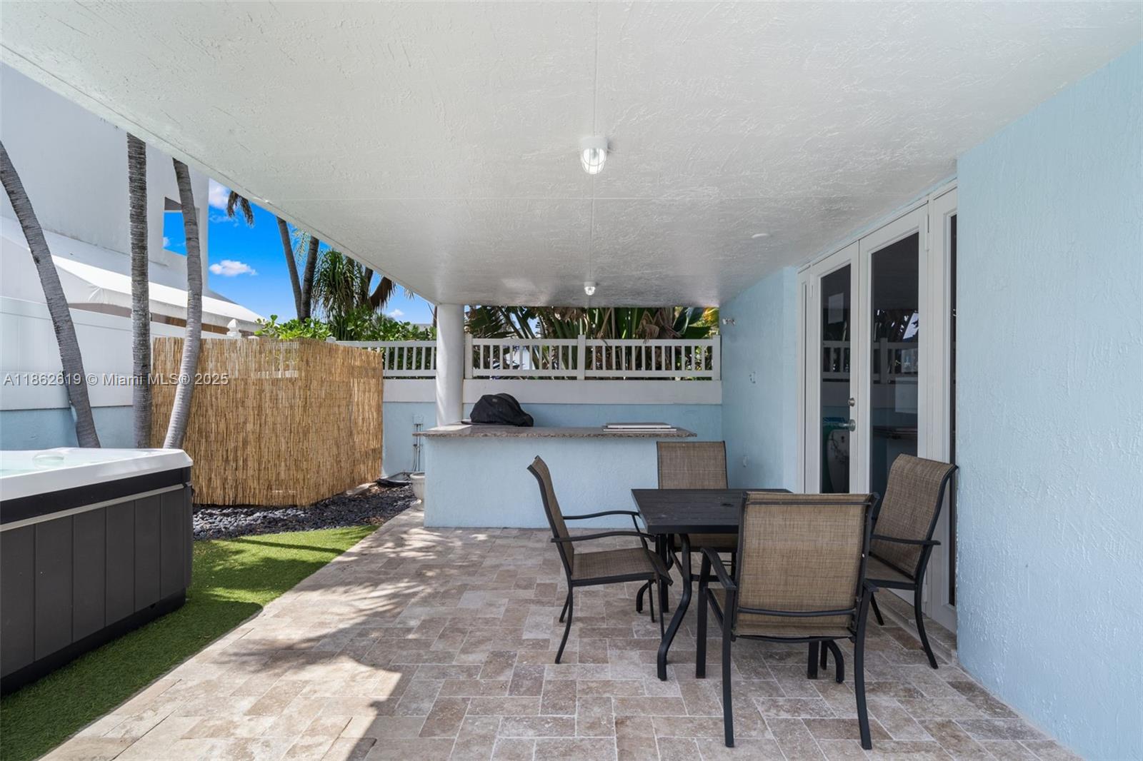 311 North Surf Road, Unit 311 Hollywood, FL 33019 - Photo 28 of 68 a view of a dining room with furniture and a window