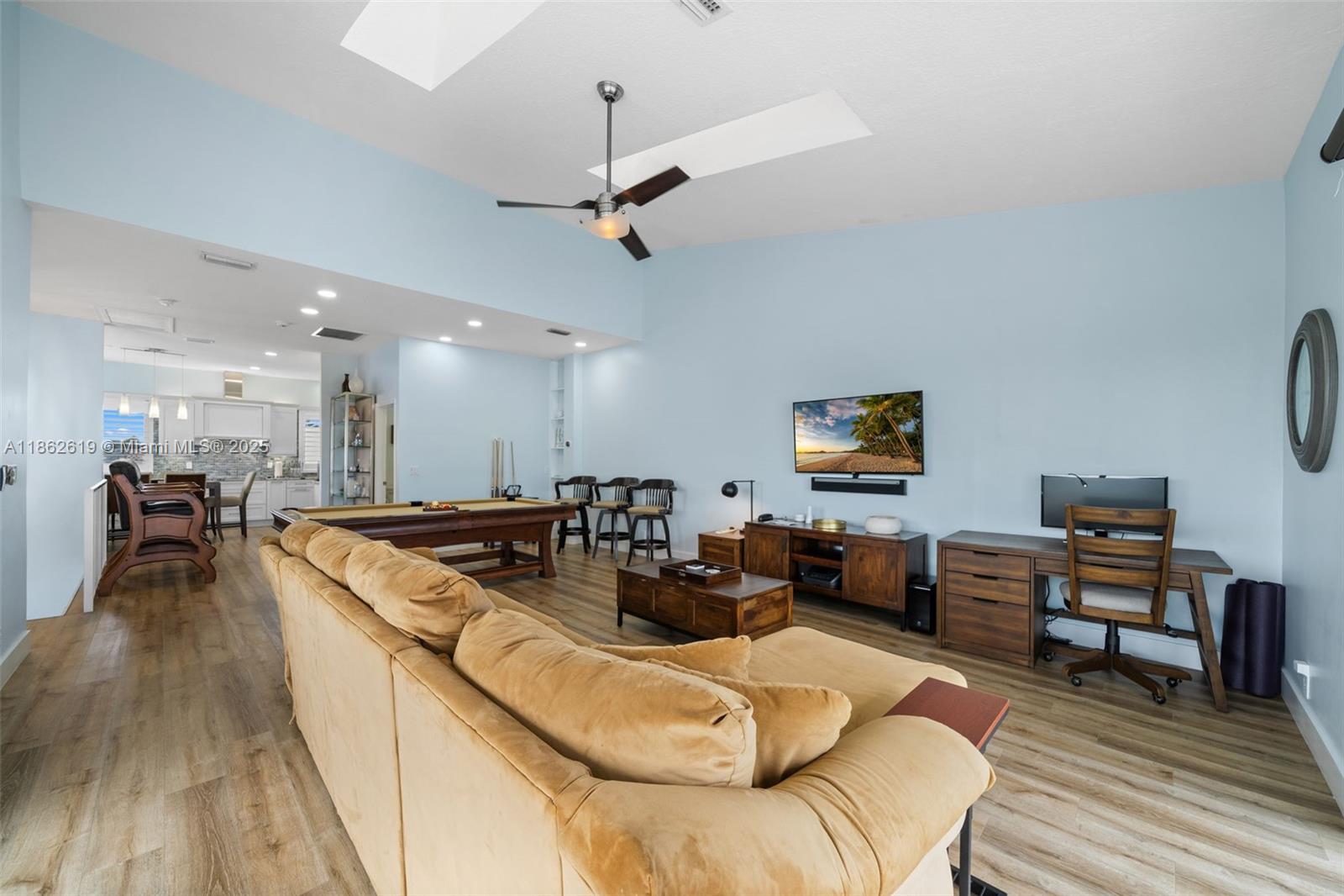 311 North Surf Road, Unit 311 Hollywood, FL 33019 - Photo 41 of 68 a living room with furniture and a wooden floor