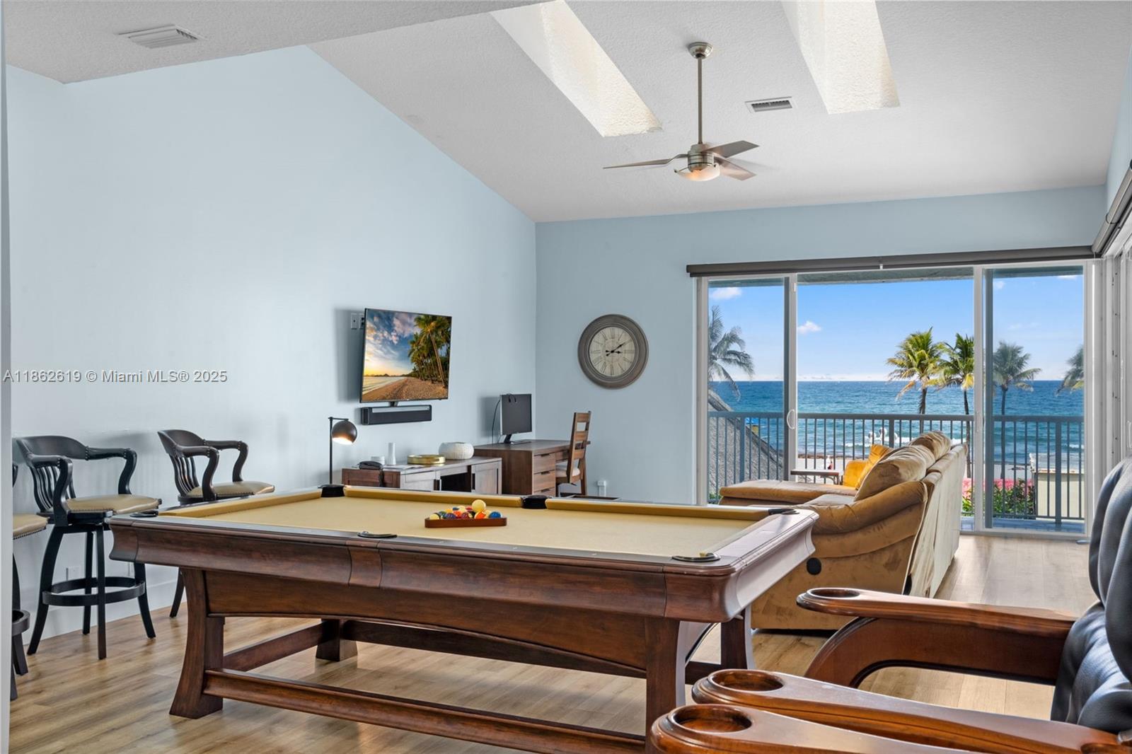 311 North Surf Road, Unit 311 Hollywood, FL 33019 - Photo 42 of 68 a room with furniture pool table and glass windows